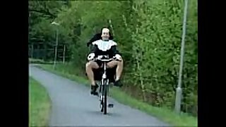 Nun on bike.wmv
